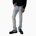Pantalón vaquero de hombre con piedra rosa