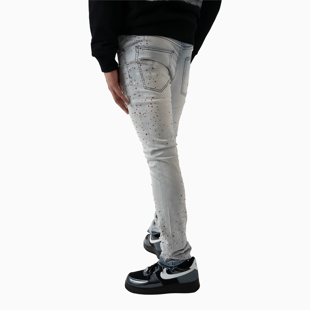 Pantalón vaquero de hombre con piedra rosa