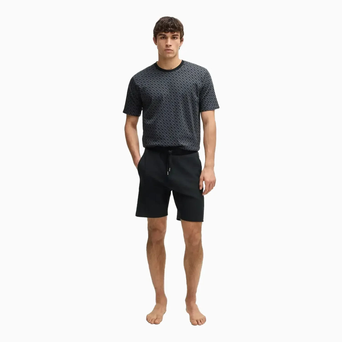 Pantalones cortos de hombre con paneles con el patrón del monograma