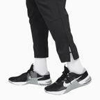 Pantalón deportivo de chándal Dri-Fit ilimitado para hombre con puño con cremallera